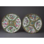 A Pair of Canton 'famille rose' Plates with panels of figures and bird and flowers, Late 19th