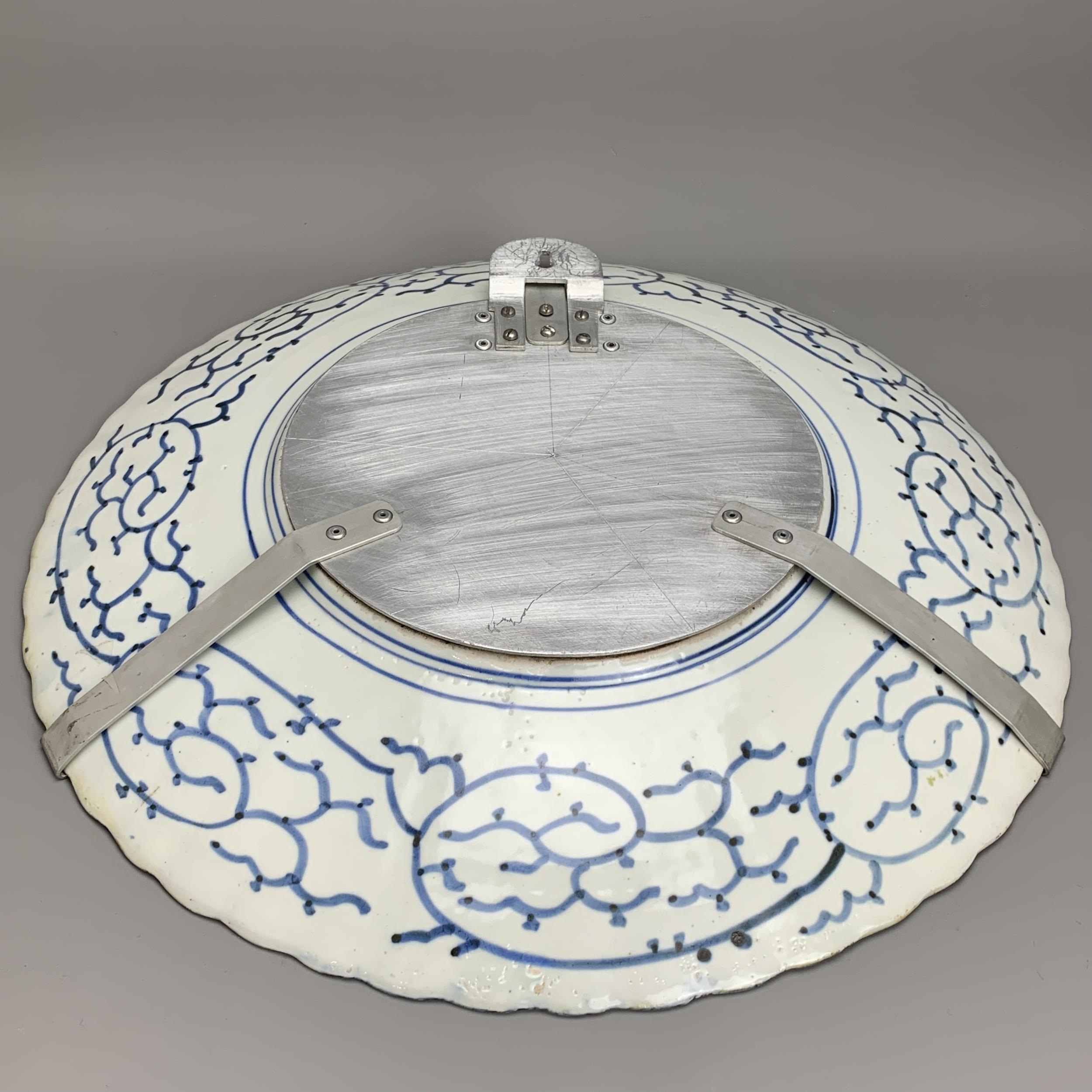 A Japanese Imari Fluted Dish, c. 1900 - - W45.5cm H5.5cm - - the shallow well with three vignettes - Image 4 of 5