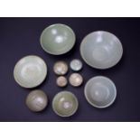 A small collection of celadon wares, comprising six bowls, a dish, a box and cover, and three