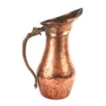 A 19TH CENTURY INDO PERSIAN QAJAR COPPER WATER JUG, having a single snake form handle. - Approx 37cm