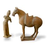 A Painted Pottery Model of a Horse and Foreign Groom, Tang Dynasty - - Horse H 36.5cm - - The