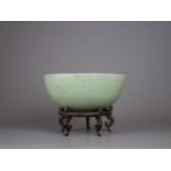 A carved Longquan Celadon Hot Water Bowl, Early Ming Dynasty, with foliate decoration beneath the