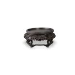 A pierced hardwood circular Wood Stand, 19th century H10.5cm D23cm with well carved pierced bamboo