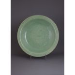 A good Longquan celadon Dish, late Ming Dynasty - - W37cm H8.5cm - - carved across the centre with