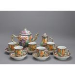 An attractive 'Mandarin Palette' Tea Service, Qianlong, - - Teapot L23cm H16.5cm Saucer D12cm H3cm