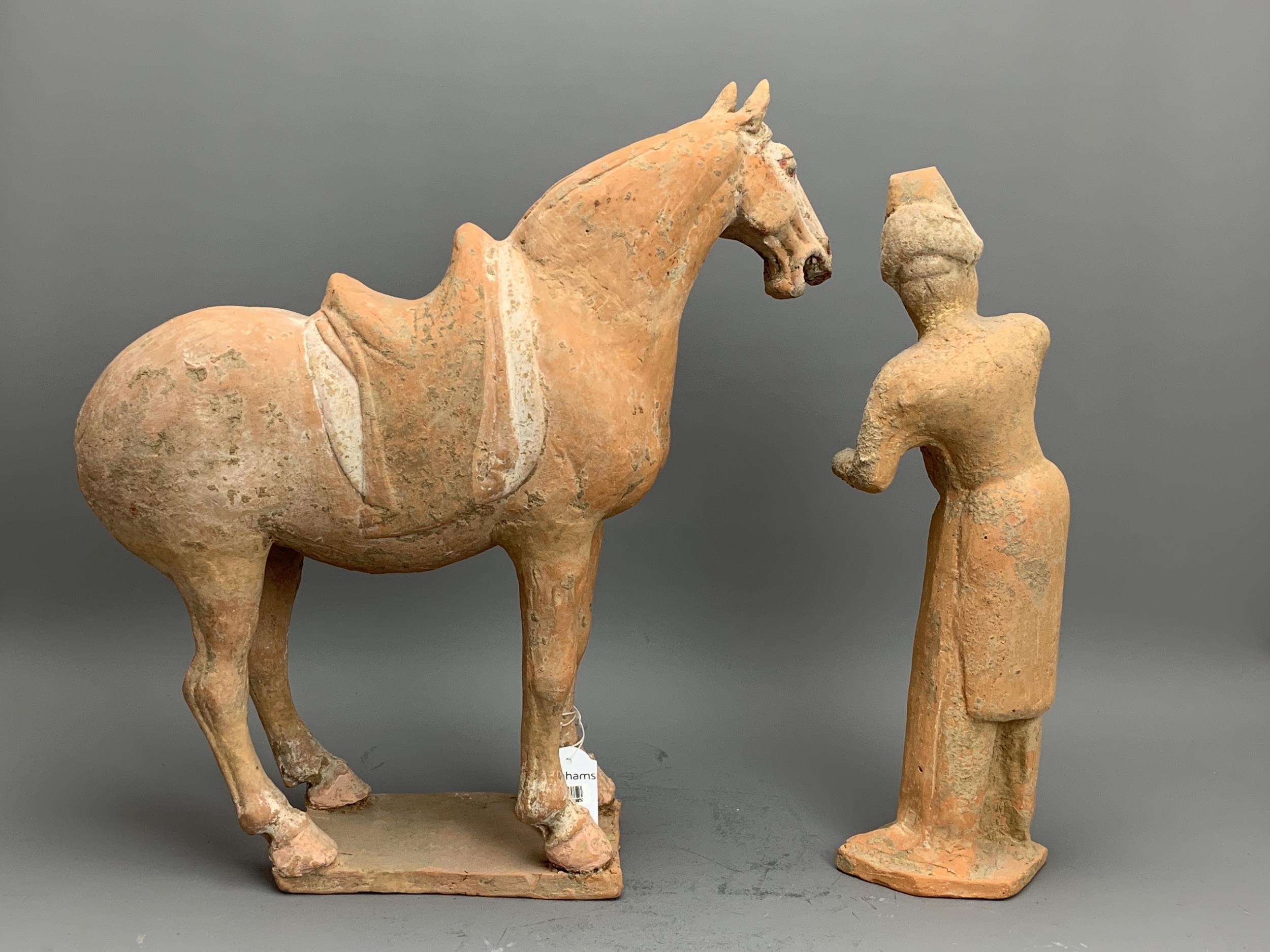 A Painted Pottery Model of a Horse and Foreign Groom, Tang Dynasty - - Horse H 36.5cm - - The - Image 2 of 4