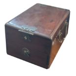 A 19TH CENTURY CHINESE HARDWOOD DRESSING BOX Having twin bronze handles and peach form design to