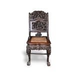 A finely carved rosewood chair with marble seat, the seat back with dragons in pierced relief, c