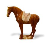 PROPERTY FROM A COLLECTION IN CHESHIRE. - A large amber glazed horse, the glaze of rich deep tone,