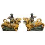 A LARGE PAIR OF CHINESE MING ROOF TILES, archers on kylins Condition some slight damage and