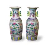 A large pair of Famille Rose 'Scholar' vases, Republic Period H61cm D23.5cm decorated in bright '