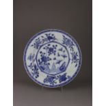 A blue and white plate, Kangxi, Qing Dynasty - - D38.2cm H4.7cm - - decorated with flowers and