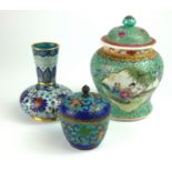 AN 18TH CENTURY MINIATURE POT AND COVER - Enamelled with rows of colourful lotus flowerheads between