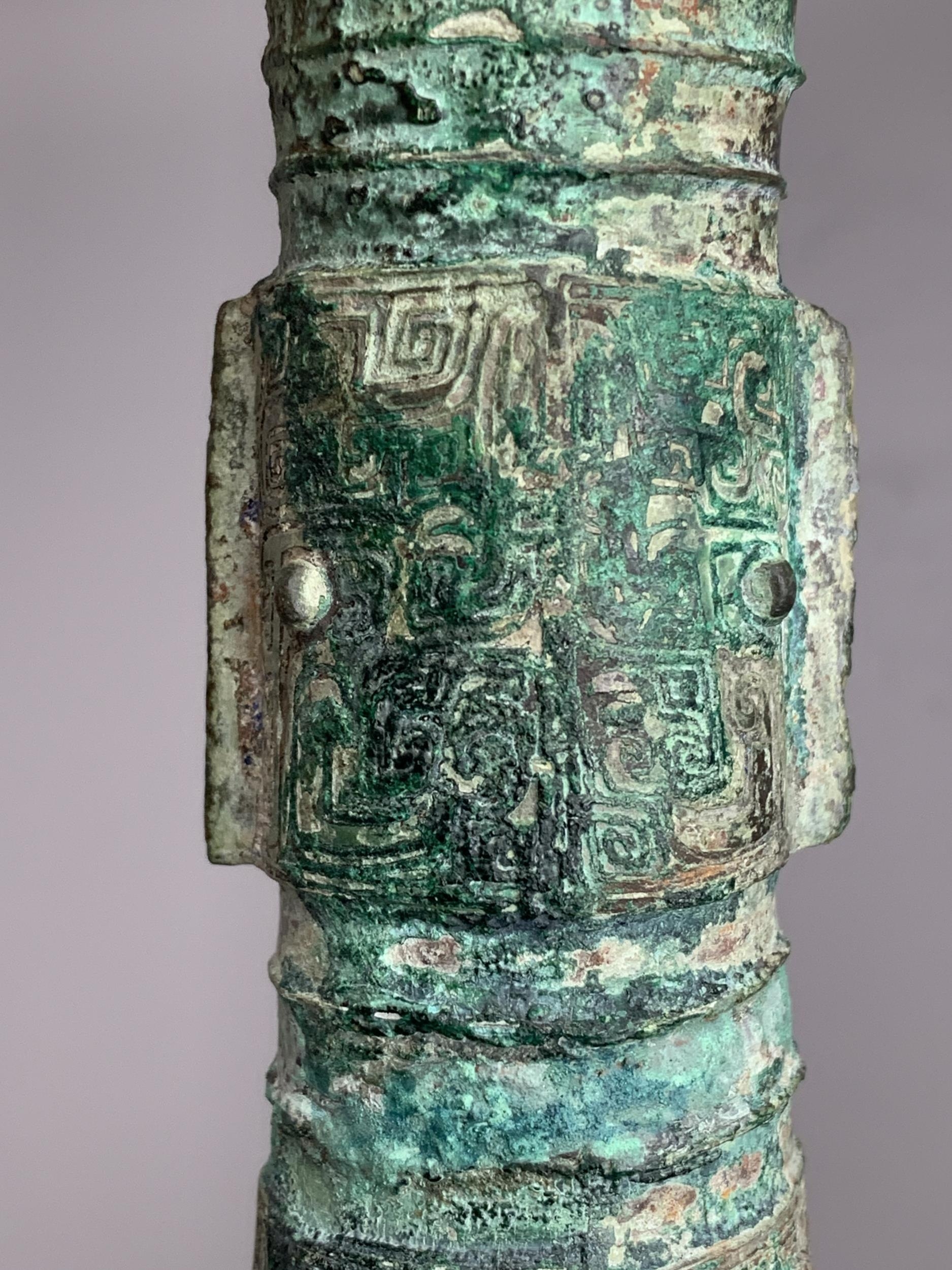 A bronze gu beaker vase, with bands of Taotie masks in low relief on the central bulb and above - Image 10 of 11