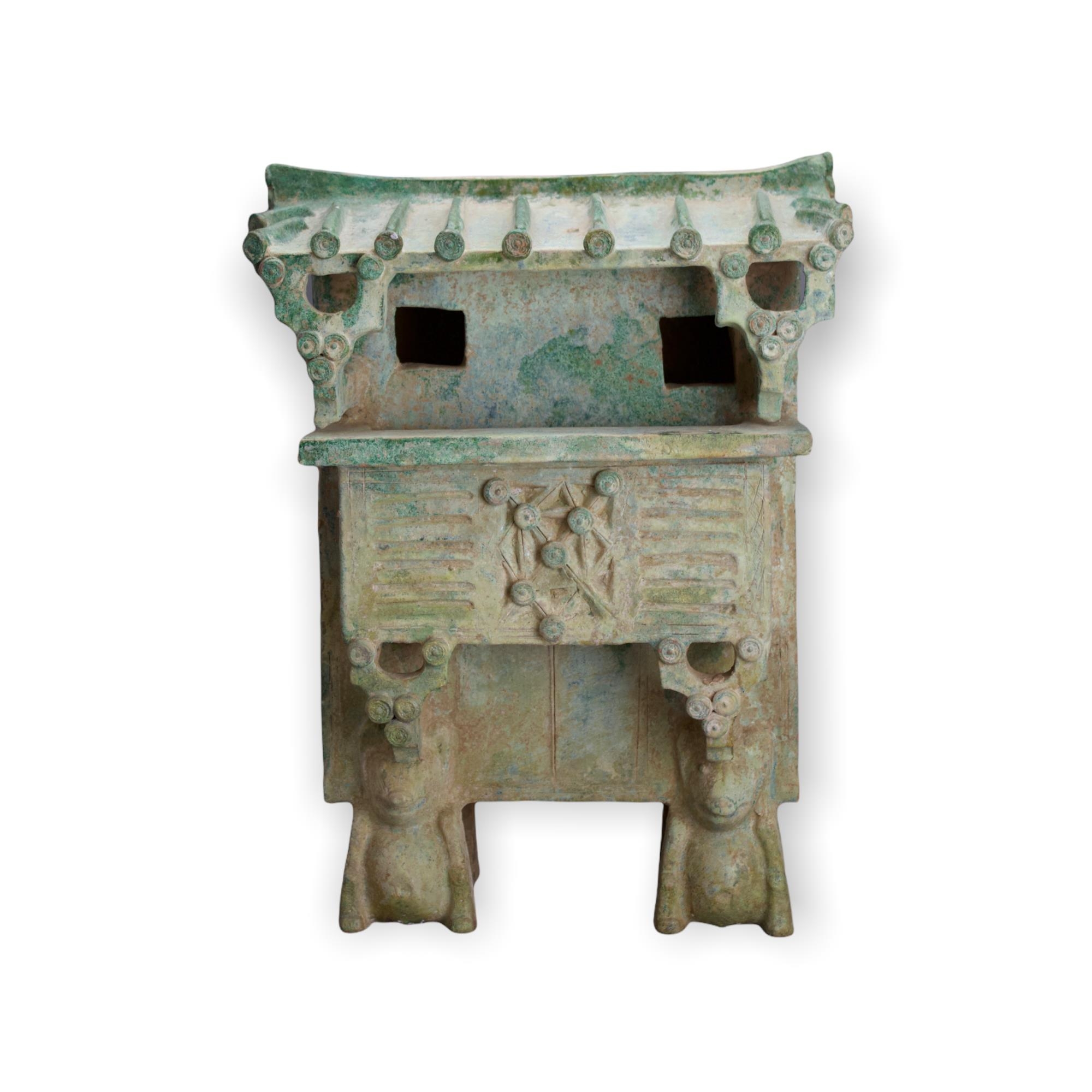 A rare green glazed pottery Watchtower, Han Dynasty - - H 46cm W 34cm D 21.5cm - - raised on four