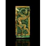 A amber and green glazed Dragon Tile, Ming dynasty - - L54.5cm W25.5cm - - of upright rectangular