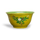 A yellow ground biscuit porcelain bowl, 19th Century - - H 30 cm D 45 cm - - decorated with three