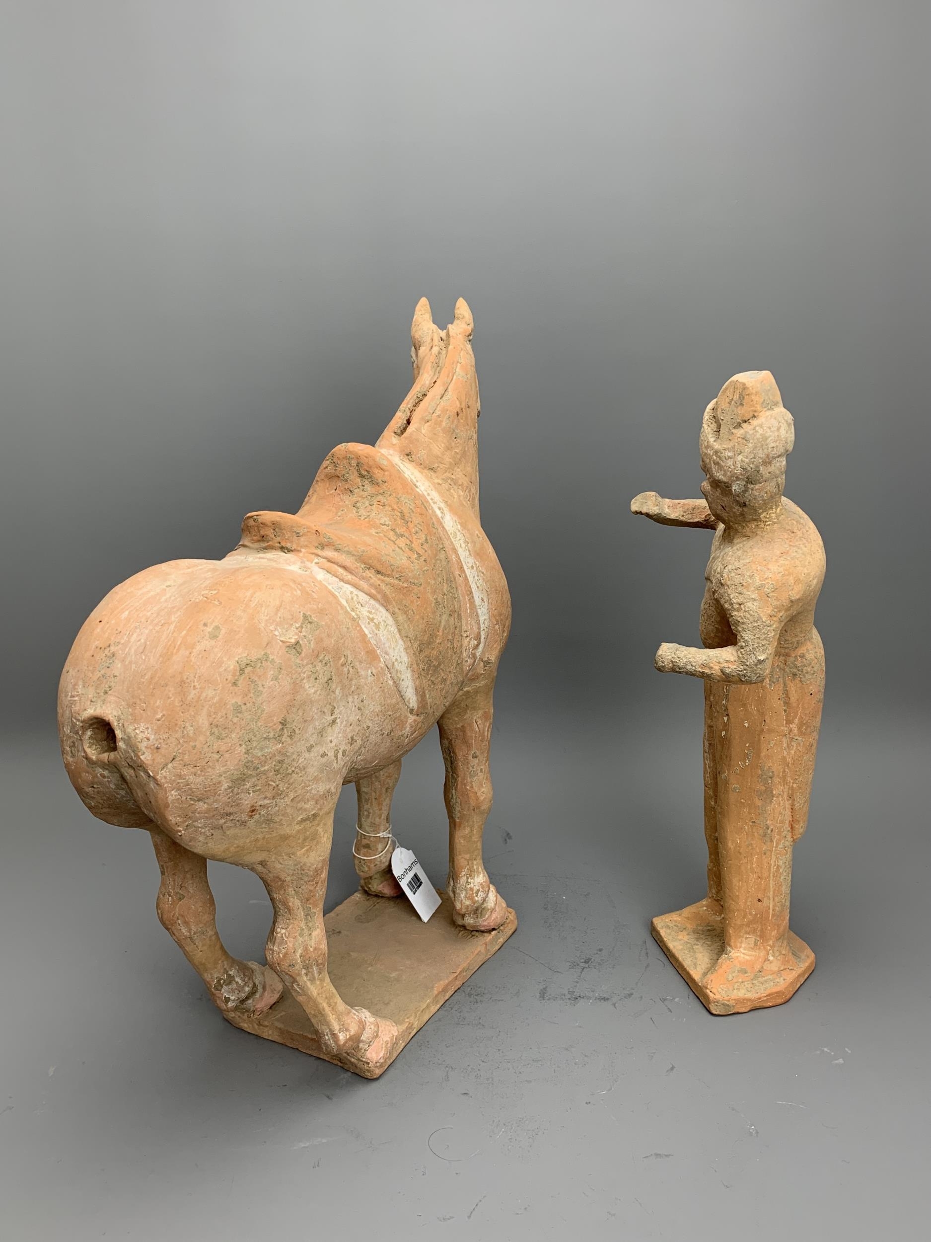 A Painted Pottery Model of a Horse and Foreign Groom, Tang Dynasty - - Horse H 36.5cm - - The - Image 3 of 4