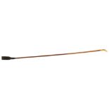 SWAIN AND CO, LONDON A LATE 19TH/EARLY 20TH CENTURY YELLOW METAL AND CANE LADIES RIDING CROP, having