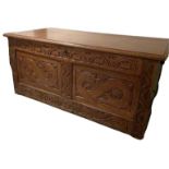 AN ANTIQUE OAK COFFER with panels carved with dragons Condition some wear, top loose. 120 x 58 x