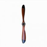 A LARGE 20TH CENTURY BROWN OAK WOOD PATINATED PROPELLER. (length 150cm)