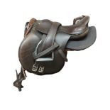 A 20TH CENTURY BROWN LEATHER HORSE SADDLE Of standard size on metal stool Oval shaped Factory mark '