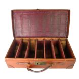 AN EARLY 20TH CENTURY LEATHER GUN CARTRIDGE CASE, rectangular form with seven compartment with
