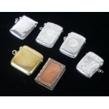 A COLLECTION OF FOUR EDWARDIAN AND LATER SILVER VESTA CASES To include a rectangular form vesta with