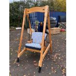 A 20TH CENTURY PINE GARDEN SWING, with loose cushions. Condition one leg base a/f 130 x 98 x 192cm