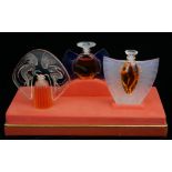 LALIQUE, LES FLACONS, A MODERN SET OF THREE MINIATURE PERFUME BOTTLES Edition of 2000, in original