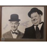 LAUREL AND HARDY, AN EARLY 20TH CENTURY SIGNED BLACK AND WHITE PHOTOGRAPH Autograph 'Stan Laurel Our