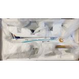 Two LUPA models of Orbest a330-200 Airbus with wooden stand. Good condition.