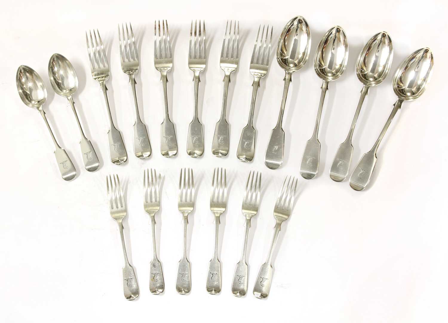 A part set of Victorian silver fiddle pattern cutlery