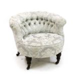 A Victorian low upholstered button back chair