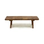 A rustic stained pine pig bench,