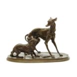 A bronze model of a whippet and a King Charles spaniel