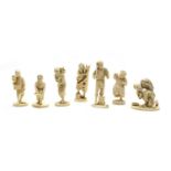 Seven various late 19th/early 20th century carved ivory sectional figures