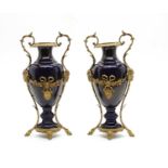 A pair of ormolu mounted blue porcelain vases,
