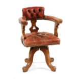 A revolving desk walnut chair,