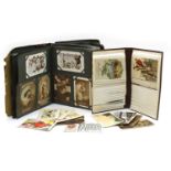 A postcard album and over 350 postcards,