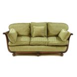 A three seat mahogany bergere sofa