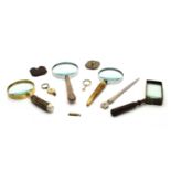 Seven various magnifying glasses,