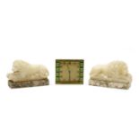 A mirrored pair of carved alabaster Canova style lions,