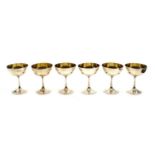 Six cased silver goblets,
