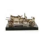 A silver scale model of a Rolls Royce,
