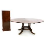 A Regency style mahogany circular extending dining table,