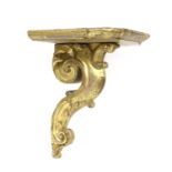 A carved giltwood wall bracket