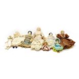 A collection of small porcelain head dolls,