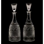 A pair of cut glass decanter and stoppers