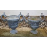 A pair of lead garden urns
